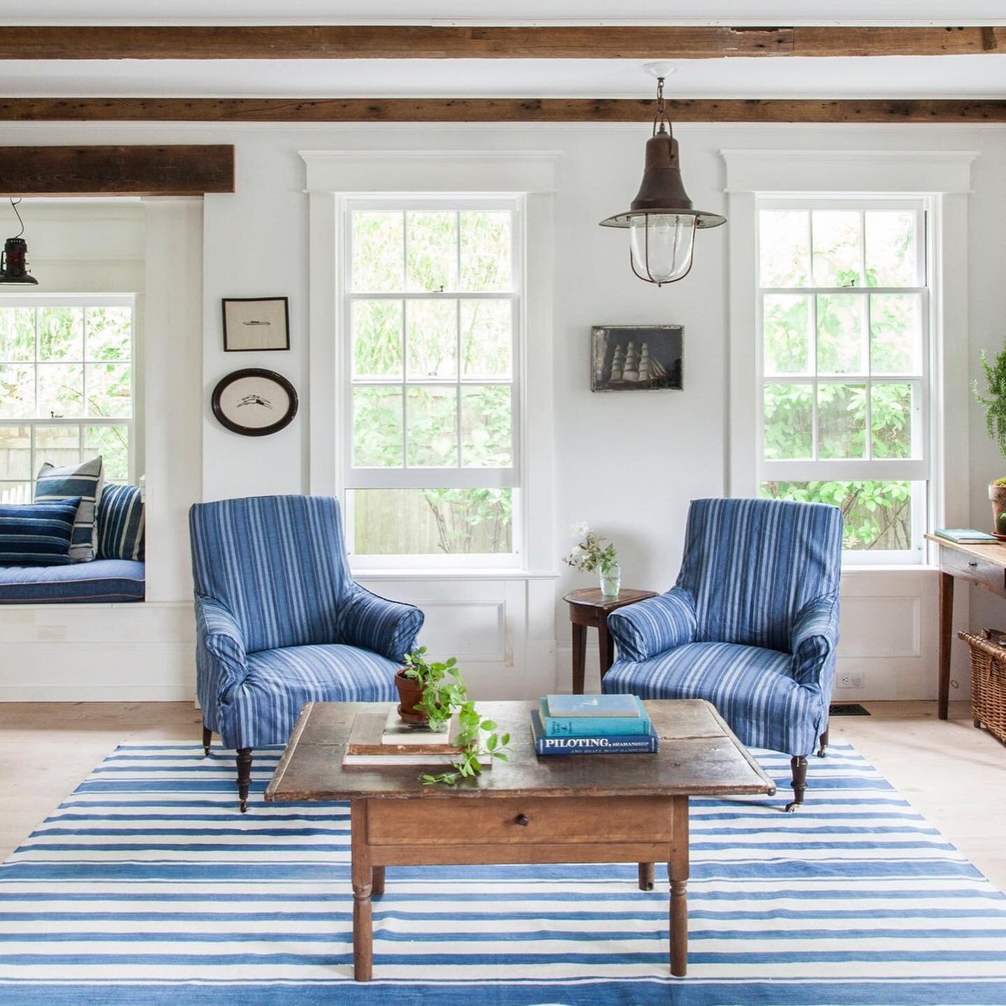 Taking a cue from Sag Harbor&rsquo;s past as a fisherman&rsquo;s village, interior designer @elizabethcooperinteriordesign and homeowners @blythe.harris and her husband Mark added classic coastal elements such as nautical-themed antiques, cotton dhur